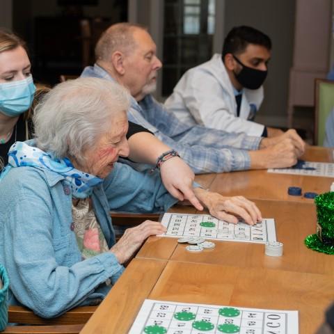 UNE health professions students play bingo with seniors at an assisted living facility